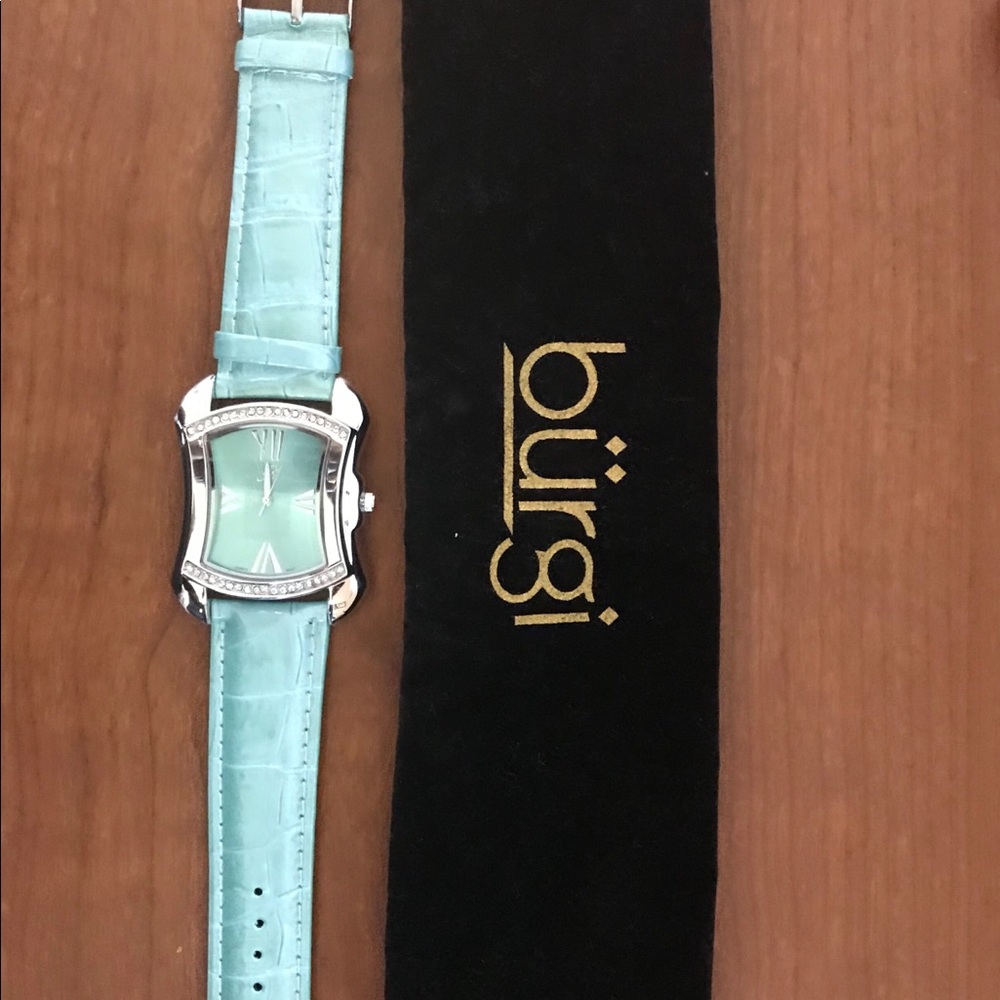 Burgi watch with light green leather band